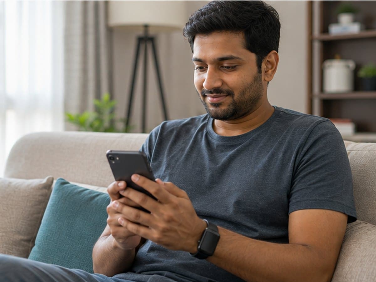 A person reading a lab report on a phone at home